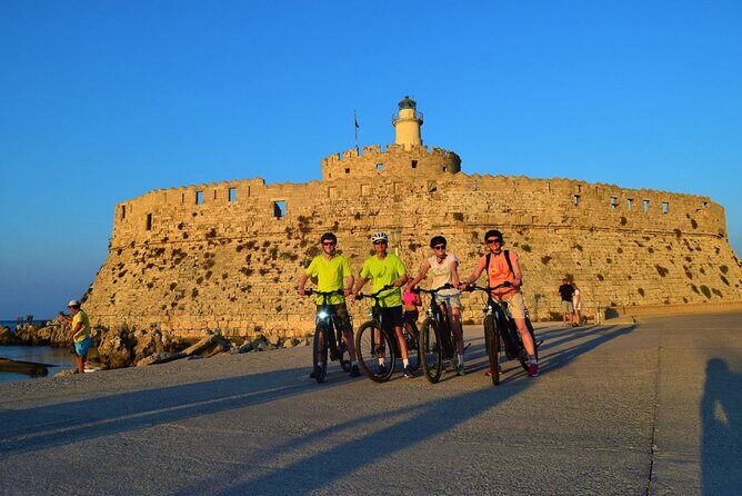 Mediaeval Rhodes E-bike Highlights Photo Tour Morning/Sunset - Mandraki Harbour: Colossus legend, deer statues, and a lighthouse castle