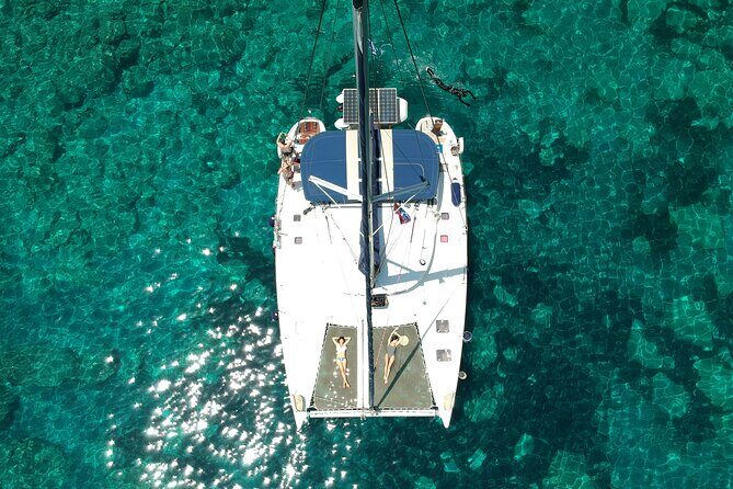 Milos caves snorkelling Catamaran Cruise in a small group - Sikia Beach Caves: Dinghy Runs, Masks On, Then Ouzo