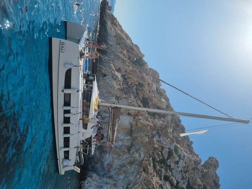 Milos: Full-Day Catamaran Cruise with Food and Open Bar - Kalogries Beach stop: breakfast first, then swim and snorkel