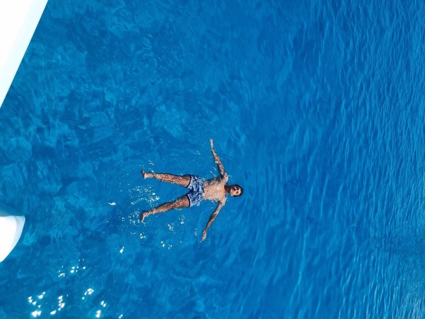 Milos: Full-Day Catamaran Cruise with Food and Open Bar - Tsigrado Beach and the Bear Rocks pass-by: camera time between swims