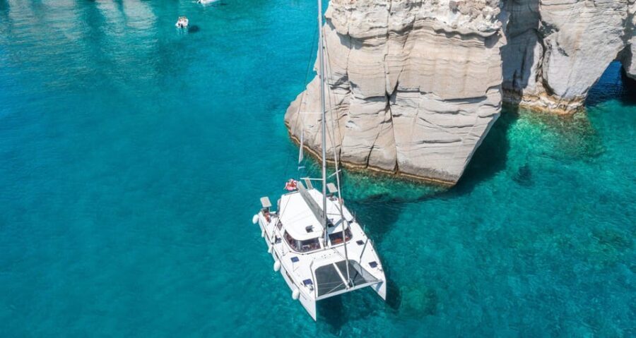 Milos: Kleftiko Morning Catamaran Cruise with Lunch & Drinks - Sailing past Klima: those white boathouses you can spot from far away