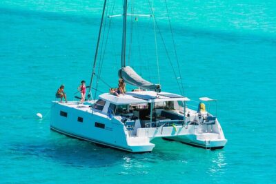Milos Luxury Catamaran Cruise to Kleftiko Bay with Lunch - Passing the colorful boats of Klima
