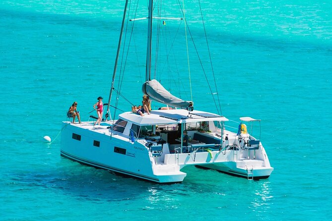 Milos Luxury Catamaran Cruise to Kleftiko Bay with Lunch - Passing the colorful boats of Klima