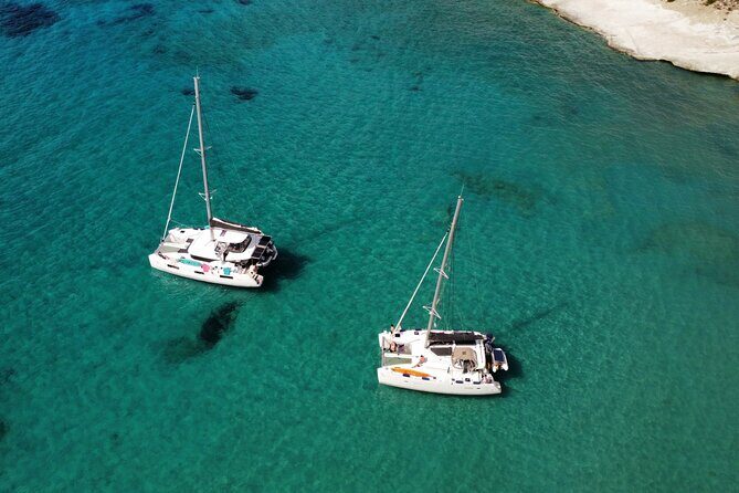 Milos & Poliegos Catamaran Cruise Homemade Full menu BBQ & Drinks - Kleftiko pirate bay: caves, rocks, and real snorkeling potential