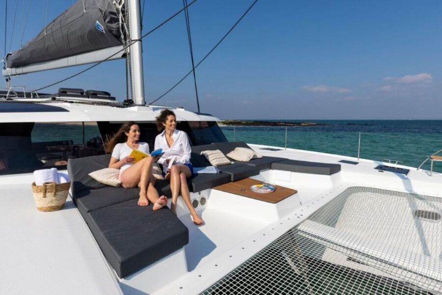 Mykonos: Catamaran Cruise with 3-Course Meal and Transfers - Sailing back: seeing Mykonos from the waterline after the swimming