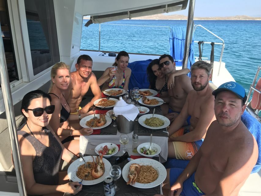 Mykonos: Full-Day Catamaran Cruise with Fresh Lunch - Swim stops, snorkeling gear, and stand-up paddleboard time