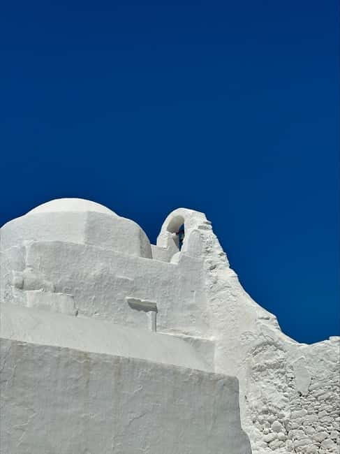 Mykonos: Guided Highlights Tour - Ano Mera village time: local streets, simple flavors, real texture
