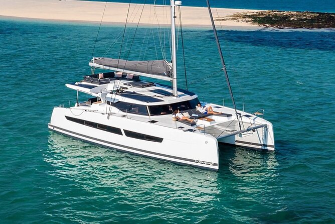 Mykonos: Luxury Catamaran Cruise with Meal, Drinks & Transport - Boarding at Agia Anna by tender boat