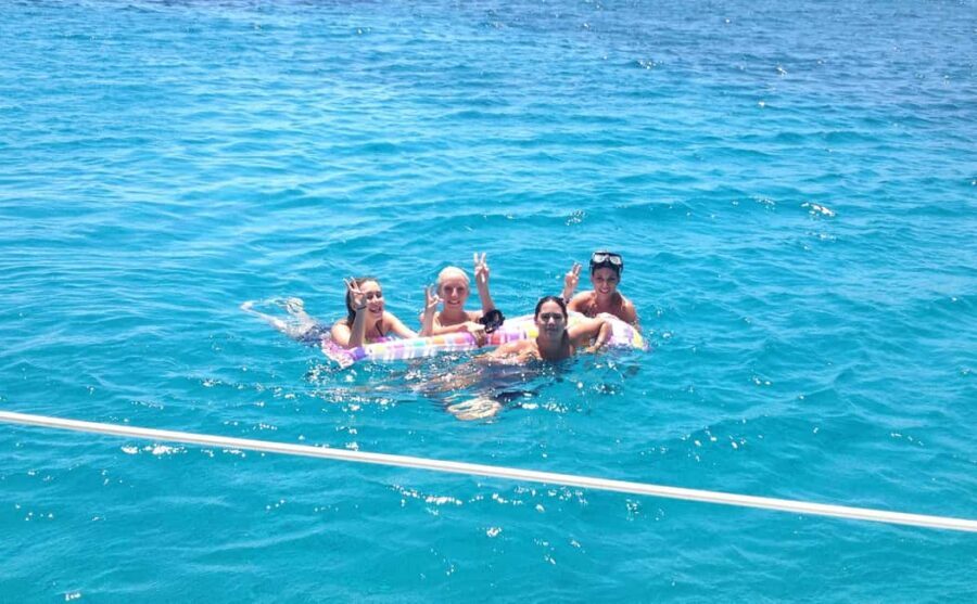 Mykonos: Sunset Sail Cruise to Rhenia, Beach Hopping, Dinner - The beach safari phase: famous Mykonos shores, mostly from the water