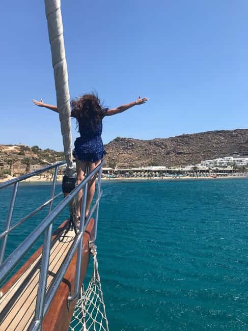 Mykonos: Sunset Sail Cruise to Rhenia, Beach Hopping, Dinner - Paradise Beach kickoff: drinks, safety briefing, and the no-shoes rule