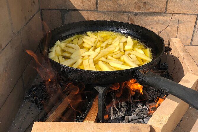 Naxos Perivoli Farm Experience & Wood-fire Cooking Class - Potatoes, fruit trees, and the garden haul before the cooking starts