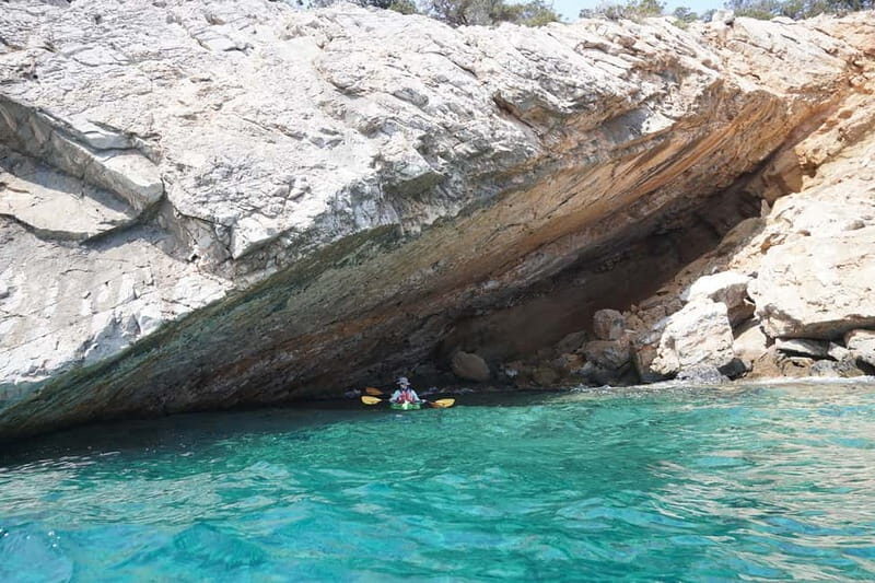 Naxos: Rina Cave Sea Kayak Tour with Snorkeling and Picnic - Entering Rina Cave: turquoise light, swim breaks, and that wow moment