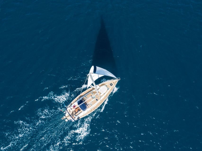 Naxos: Sailing Cruise with Lunch & Drinks - Swim and snorkel stops: crystal water, practical gear, and motion tips