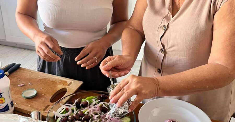 Oia: Greek Cooking Class and Lunch with a Local Grandmother - Oia’s Private Kitchen: Meeting Areti Outside Karma Restaurant