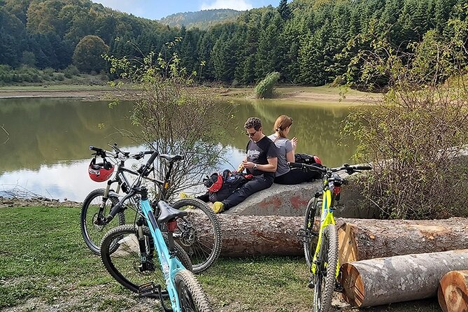 Olympus Mountain Biking - Rides tailored to you - Riding toward the Mount Olympus lake
