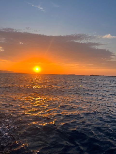 Paros: Sunset Boat Tour to Antiparos with Wine - Antiparos Stop: Wine, Short Sightseeing, and Swim Time