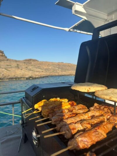Porto Rafti: Athens Cruise Tour with Mediterranean BBQ - What lunch is like on a moving boat