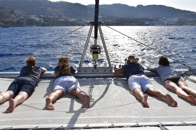 Private CATAMARAN daytrip - Lindos/ Rhodos with Lunch and drinks - The Boat Experience: Front Net Lounging, Cushions, and Onboard Restroom