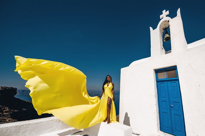 Private Flying Dress Photoshoot in Santorini - Oia brings the famous Santorini postcard