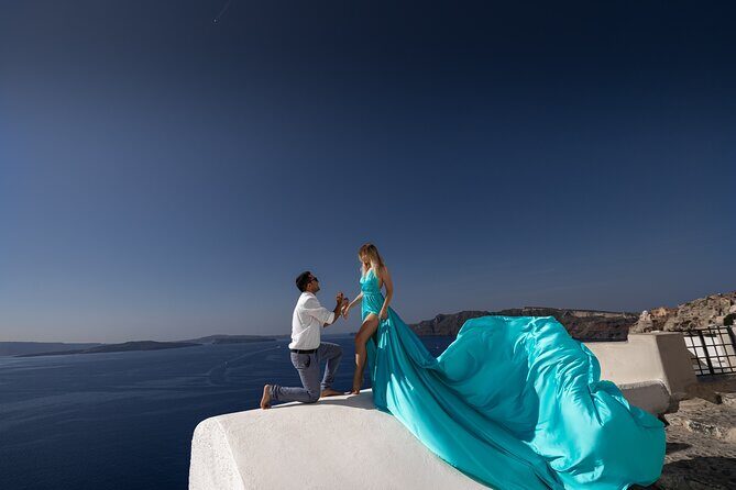 Private Flying Dress Photoshoot in Santorini – Blue Domes View - Posing guidance that keeps it natural