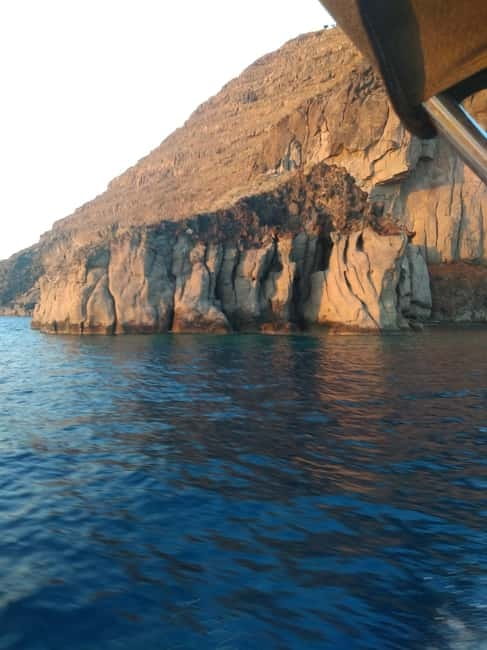 Private, fully customizable cruise in Santorini's caldera - Therasia, fisherman boat houses, and elephant-skin rocks