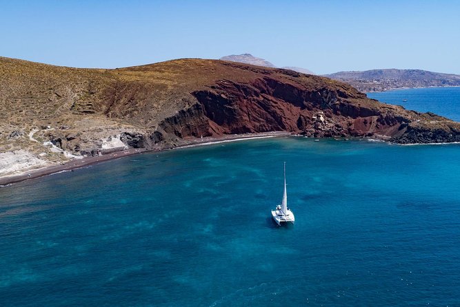 Private Luxury Caldera Cruise with a rich BBQ meal and Open Bar! - Red, White, and Black Beaches From a Catamaran