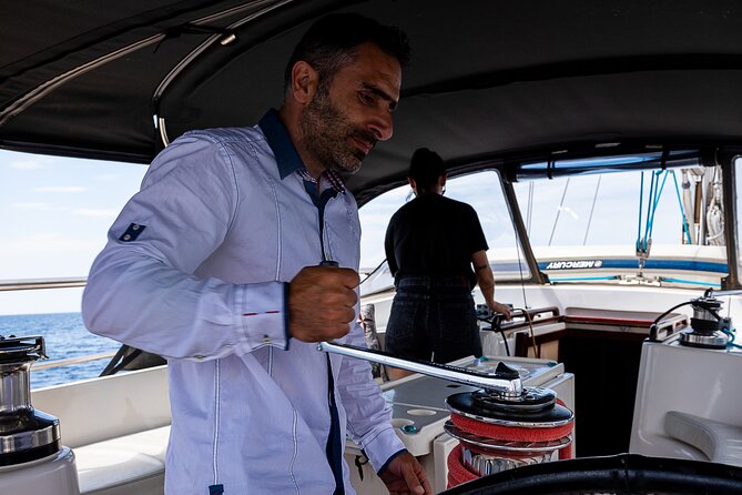 Private Luxury Sailing Cruise in Athens Riviera With Lunch - Vouliagmeni Bay, cliffs, and a second swim