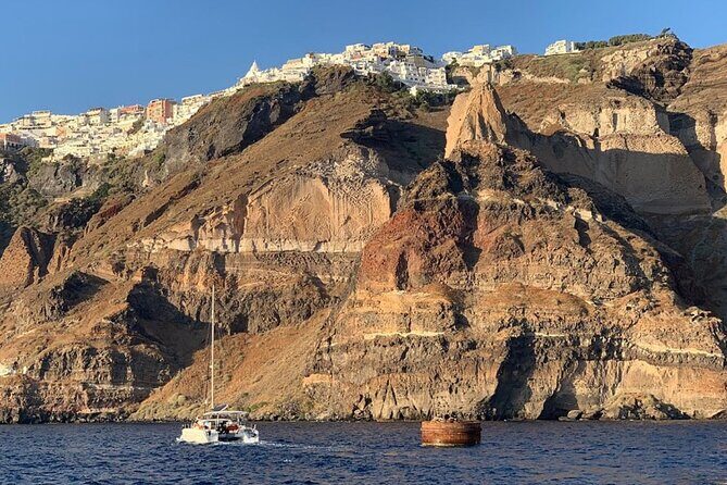 Private Luxury Santorini Catamaran Cruise with Port Pickup - Red Beach swim stop: iconic volcanic sand, but time is tight
