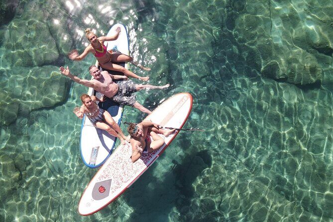 Private Mykonos Catamaran Day Cruise with Meals & Water Toys - Rineia Stop: Clear Water and Calm Anchors