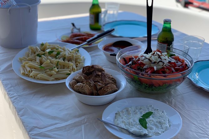 Private Sunset Cruise Including Meals And Drinks - Leaving Mykonos by private catamaran