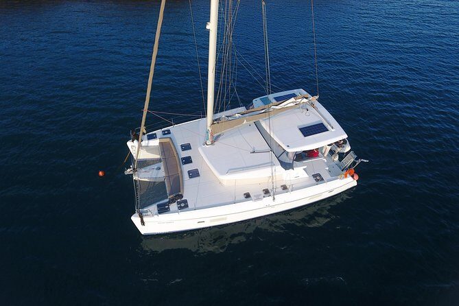Private Sunset Cruise with Full Greek Dinner - Caldera cruising: spotting Fira, Firostefani, Imerovigli, and Oia from afar