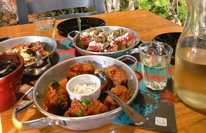 Rethymno Old Town: A Traditional Cretan Food Tour - The first tavern stop: raki welcome and a grounded introduction
