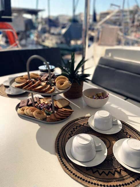 Rethymno Premium Catamaran Cruise: Healthy Lunch & Open Bar - Getting on board at Rethymno Marina: snacks, gear, and the tone