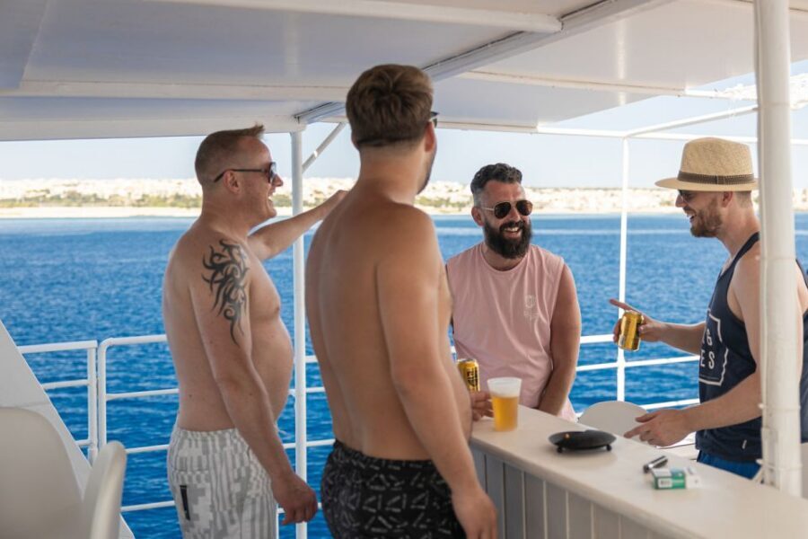 Rhodes: Bay to Bay Swim Cruise with Greek Buffet and Wine - Cruising Past Big Rock Formations: The Scenic Middle That Most Tours Skip
