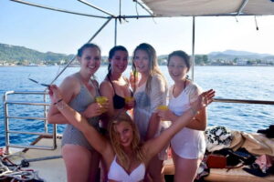 Rhodes: Boat Party Cruise with Live DJ - Anthony Quinn Bay Swim Stop and the Champagne-Plunge Game