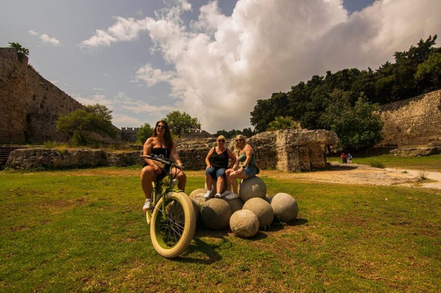 Rhodes: E-bike Highlights Sunset or Morning Photo Tour - Mandraki Harbour, the Clock Tower, and the harbour-side storytelling vibe
