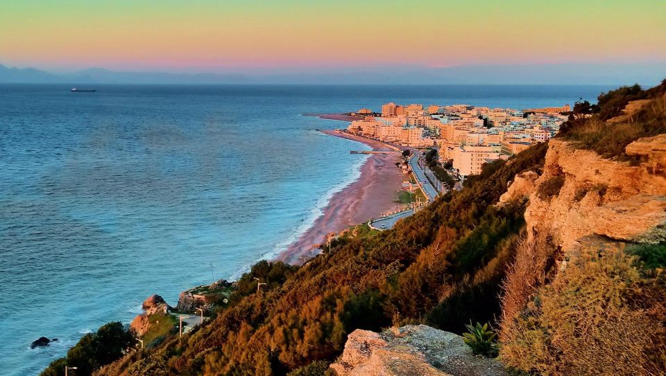 Rhodes: Guided Rhodes City By Night with Live Music & Dinner - Mandraki Harbor and Rhodes’ seafaring symbols