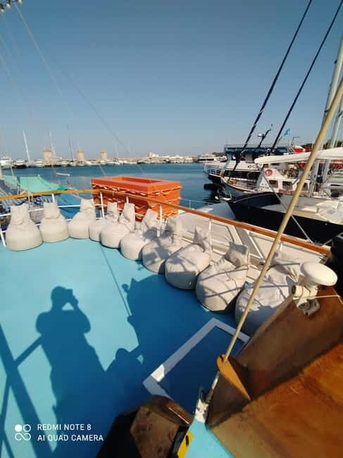 Rhodes: Pleasure Cruise for Swimming and Snorkeling - Food and Drinks on Board: Seasonal Fruit and Purchase-Only Extras