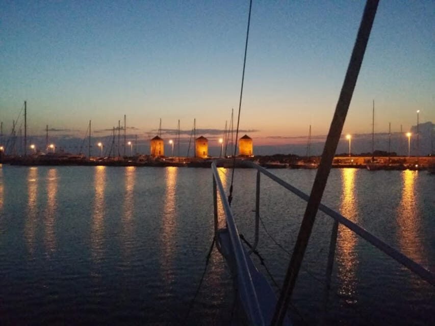 Rhodes: Sunset Cruise with Live Music, Wine & Greek Buffet - Unlimited wine and the onboard bar option