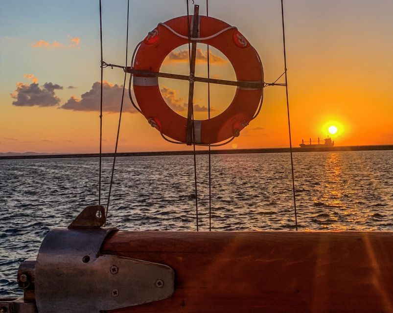 Rhodes Town: Sunset Boat Cruise with Drinks & Snacks - Music, dancing, and the mood on deck