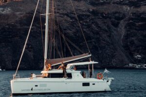 Romantic Sunset Catamaran Caldera Cruise incl. Meal & Drinks - Stop by Stop: Red Beach, White Beach, and the Volcanic Water Stops