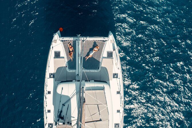 Romantic Sunset Catamaran Caldera Cruise incl. Meal & Drinks - Crew and Group Size: Friendly Service vs. Party-Ship Energy