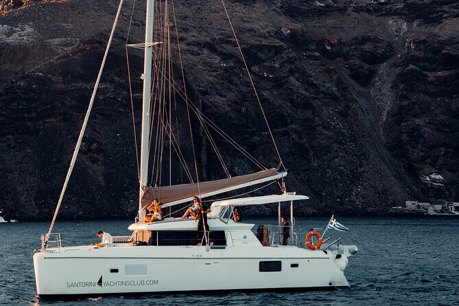 Romantic Sunset Catamaran Caldera Cruise incl. Meal & Drinks - Stop by Stop: Red Beach, White Beach, and the Volcanic Water Stops