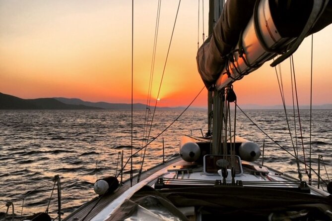 Sailsational Luxury Santorini Catamaran Sunset Cruise with Dinner - Red Beach, where volcanic rock meets the Aegean