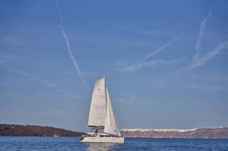 Santorini: Caldera Classic Catamaran Cruise w/ Meal & Drinks - Mésa Pigádia: snorkeling among colorful fish without the chaos of a public beach