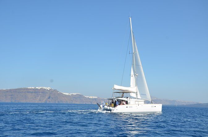 Santorini Caldera Gold Day Cruise with BBQ on board and Open Bar - Stop-by-Stop: Vlychada, Red Beach, White Beach, and the Akrotiri Views