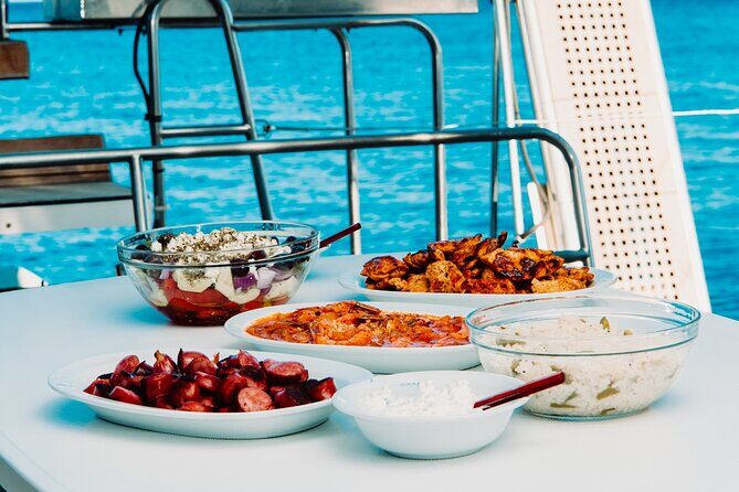 Santorini Caldera Gold Day Cruise with BBQ on board and Open Bar - Volcano Cruise Time and the Hot Springs Swim at Nea Kameni