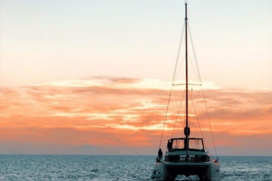 Santorini Caldera: Panorama Winter Cruise - Black Mountain and the lighthouse waters