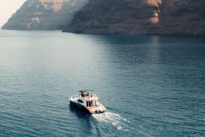 Santorini: Caldera Private Power Catamaran Cruise - Getting from Thera to Ammoudi Bay: the 45-minute van ride and packing tips