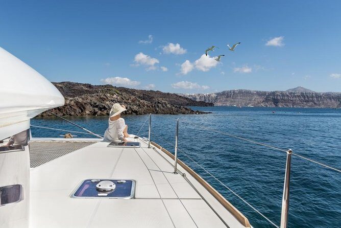 Santorini Caldera Sailing Tour with BBQ Lunch and Drinks - Sailing past Indian Head and the Old Venetian Lighthouse